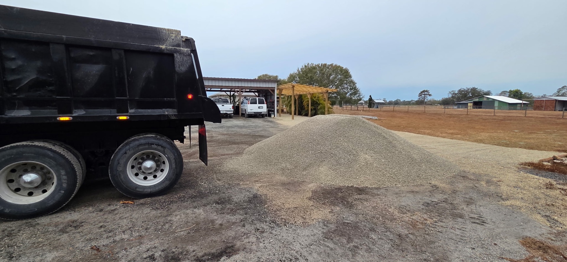 Trejo Transport dump truck delivering gravel in Bradenton FL